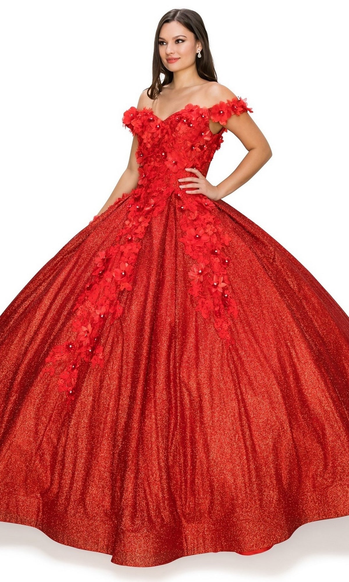A woman poses against a white background in the Quinceanera Ball Gown 8020J, featuring an off-the-shoulder design, 3D floral details, and a full glitter skirt.